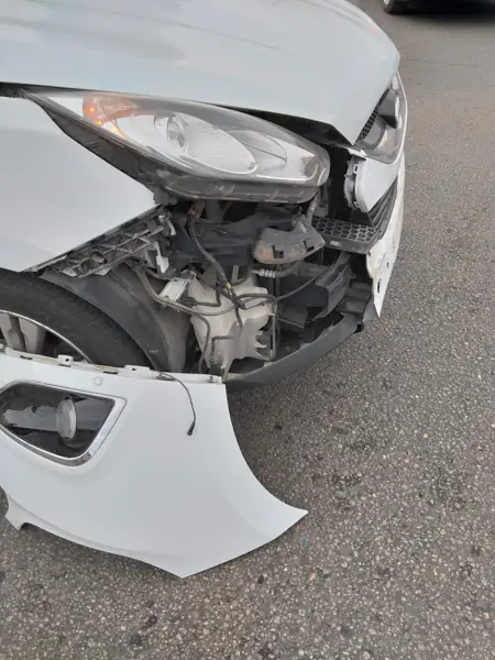 Front end with headlight and bumper removed