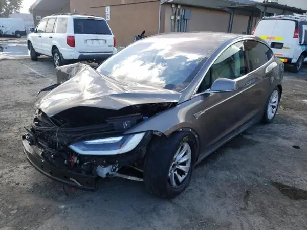 Tesla with damage to the front of the body