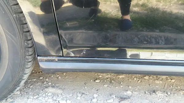 Damage to the lower door and sill